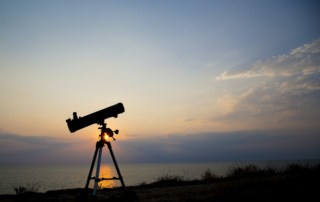 the telescope silhouette at orange sunset